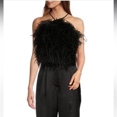 From Antonio Melani, This Blouse Features: Satin Fabrication Halter Neckline Sleeveless Button Back Closure Lined Approx. 13.5" Center Back Polyester/Elastane/Ostrich Feathers Spot Clean Imported. Black Feathered Party Top, Chic Tank Top For Fall Night Out, Sleeveless Feather Trim Tops For Spring, Sleeveless Tops With Feather Trim For Spring, Spring Sleeveless Tops With Feather Trim, Elegant Feathered Evening Tops, Chic Black Top With Feather Trim, Spring Night Out Tops With Feather Trim, Feather Trim Tops For Night Out In Spring