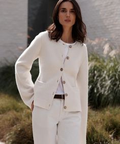 Cooper Cardigan Warm Ivory Featuring a structured hourglass silhouette and a very slight bell sleeve, this chic knit is unlike anything we’ve done before. Ultra-soft wool cashmere and a classic shape are easily styled with everything from wide-leg trousers to your favorite skirt. 70% wool, 30% cashmere. Made in China. White Sweater Coat With Button Closure, Elegant Cream Button-up Cardigan, Classic Winter White Cardigan For Work, Elegant Wool Cardigan For Workwear, Fitted Winter White Sweater For Workwear, Chic Single-breasted Cardigan For Work, Elegant Fall Cardigan For Workwear, Elegant Cream Button-up Sweater, Elegant Winter White Sweater For Work