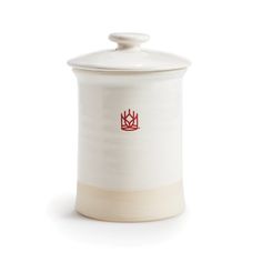 a white canister with a red crown on the front and bottom, sitting against a white background