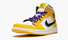 The Air Jordan 1 Mid “Lakers” is a special edition of the mid-top Jordan 1 inspired by the Los Angeles Lakers.  The Jordan 1 Mid is outfitted in the team colors of the team Michael Jordan and the Chicago Bulls defeated in the 1991 NBA Finals.  The Air Jordan 1 features a white leather base with University Gold full-grain leather overlays and a black Swoosh and inner lining.  Purple laces are added to complete the Lakers look.  The Air Jordan 1 Mid “Lakers” released in early 2019. Air Jordan 1 Mid Se, Jordan 8, Air Jordan 1 High, Air Jordan 1 Low, Jordan 1 Low, Jordan 1 High, Nba Finals, Air Jordan 1 Mid, Air Jordan 1 Retro