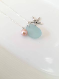 This beautiful Irish mermaid tear necklace is made with genuine sea foam blue sea glass found by me on the Wild Atlantic Way of Ireland. Amazing shapes, made by the Wild North Atlantic over decades and put together to complement each other as a dainty gift from the Mystical Emerald Island of fairies, leprechauns, elves and mermaids. Comes in an elegant jewellery box ready as a gift.  If you need a bigger quantity or any customized jewellery for your very special occasion (birthdays, weddings, bridal showers or any other event), please send me a message and I'll be glad to help. Blue Sea Glass Necklaces For Jewelry Making, Ocean-inspired Sea Glass Necklaces For Beach, Ocean-inspired Blue Sea Glass Necklaces, Irish Mermaid, Blue Sea Glass Necklace, Beach Glass Necklace, Mermaid Tears, Wild Atlantic Way, Elegant Jewellery