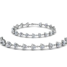 The Heart Diamond Tennis Bracelet flourishes fine elegance with the lovely heart shaped diamonds studded in a classic prong setting arranged horizontally all over the delicate bracelet.  Heart cut diamonds of 9.50 Total Carat Weight with Clarity SI2 and Color G  in a prong setting. Total Number Of Diamonds:- 19 This heart diamond tennis bracelet is also customizable with numerous other lustrous metals of your desired choice. Free Shipping within USA. Direct Manufacturing Prices. One Year Manufacturing Warranty. Easy Financing Available. Professionals of medical field, lawyers, government employees, military officers and university staffs can gain a discount of 5% on purchase of any jewelry. Receive your merchandise within 5-7 business days via FedEx or UPS, and Fascinating D Luxury Heart Cut Tennis Bracelet In Fine Jewelry, Luxury Diamond Tennis Bracelet With Heart Cut, Diamond Tennis Bracelet, Heart Diamond, Heart Shaped Diamond, Medical Field, Platinum Metal, Tennis Bracelet Diamond, Best Diamond