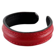 a close up of a red leather bracelet