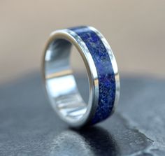 This ring is one of my favorites! The deep blue pigment of this stone looks amazing with the handmade .925 Sterling Silver ring core. Lapis Lazuli is the traditional birthstone of December and also encourages self-awareness, allows self-expression and reveals inner truth, providing qualities of honesty, compassion and morality to the personality. Stimulates objectivity, clarity and encourages creativity. Lapis Lazuli assists to confront and speak one's truth and inspires confidence. This ring is Blue Polished Finish Promise Ring, Blue Polished Promise Rings, Untreated Blue Ring For Anniversary, Untreated Blue Rings For Anniversary, Sterling Silver Jewelry With Polished Edges For A Wedding, Ring Gift Ideas, Silver Ring Wedding, Blue Pigment, Sterling Silver Wedding Rings