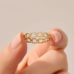 The Diamond Pave Chain Ring is a striking and unique symbol of style and sophistication. Crafted in your choice of 14k, 18k, or 10k Solid Gold, this wide wedding band features a Cuban link chain design adorned with pave-set diamonds, creating an Eternity Wedding Band. Ring Details * 14k Solid Gold (also in 10k,18k) * Band Options; Yellow Gold, White Gold Rose Gold * Band Width: 4.35 mm * Thickness: 1.31 mm * Gemstone: Genuine White Diamond * Gem Color and Clarity: G Colour SI Clarity * Total CTW Wide Wedding Bands, Gold Cuban Link Chain, Rose Gold Band, Chain Design, Eternity Wedding Band, Cuban Link Chain, Ring Women, Cuban Link, Wide Bands