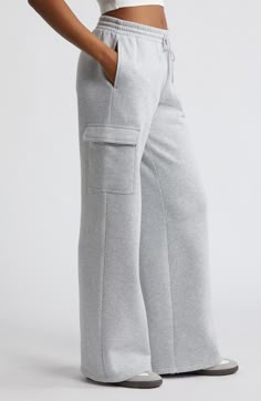 Cargo pockets and wide legs make these fleecy sweatpants right on trend for cool weather and days when you just want to be cozy. 32" inseam; 32" leg opening; 12 1/2" front rise; 13 1/2" back rise (size medium) Elastic/drawstring waist Side flap-patch pockets 68% cotton, 32% recycled polyester Machine wash, tumble dry Imported Not available for sale and shipment to Germany Cargo Sweatpants Outfit, Open Leg Pants, Cargo Sweats, Winter Sweatpants, Sweatpants Wide Leg, Sweatpants Cargo, Preppy Outfits For School, At Home Outfits, Cargo Sweatpants