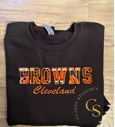 Cleveland Browns  crewneck sweatshirt.  Send me a message if you want a tshirt or hoodie quote.  Will look same as the photo unless you want to change the sweatshirt color to orange, gray, or white. And can change thread color as well. Add a note if you want a different color crewneck or thread color other than what is listed Game Day T-shirt With Embroidered Logo, Custom Embroidered Crew T-shirt For College, Custom Embroidery Crew T-shirt For College, College Crew T-shirt With Custom Embroidery, College Crew T-shirt With Embroidered Text, Game Day Crew Neck T-shirt With Letter Embroidery, Brown Crew Neck Top With Embroidered Logo, Brown Cotton Sweatshirt With Embroidered Logo, Crew T-shirt With Letter Embroidery For College