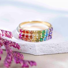 ---------------------------------------------------- Rainbow Eternity Band THE PRODUCT - Weather you're buying this for your love of rainbows, multiple gemstone properties, to show your support of the LGTBQ+ community, or celebrate your pet who have crossed the rainbow bridge, this is the most beautiful all natural gemstone rainbow ring you will ever find!  - This handmade eternity band is made with natural : ruby, garnet, citrine, lemon topaz, peridot, emerald, blue topaz, and amethyst. - We ha Adjustable Rainbow Gemstone Ring, Rainbow Multi-stone Jewelry For Promise Ring, Rainbow Gemstone Jewelry Ring, Rainbow Stackable Jewelry For Promise Ring, Multicolor Half Eternity Rings As Gift, Multicolor Jewelry For Pride Gift, Pride Multicolor Jewelry Gift, Round Multicolor Jewelry For Promise, Rainbow Gemstone Ring