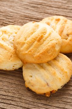 four cookies sitting on top of a wooden table