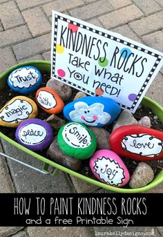 rocks in a bucket with the words how to paint kindness rocks and free printable sign