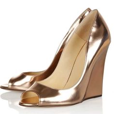 Step into elegance with our Champagne Metallic High Heels. These Peep Toe Wedge Pumps are perfect for evenings, blending style and comfort seamlessly. Elevate your look effortlessly. Color: Champagne Heel Type: Wedge heel Heel height: 4.72" / 120 mm approx Product measurements were taken using size 8. Please note that measurements may vary by size. Toe: Peep toe Padded insole for all-day comfort. Champagne color explains the personality of nobility. The wedge helps to reduce the pressure on your foot. Customization service would be provided. Handcrafted US sizing. Fits true to size. Gold Elegant Platform Sandals, Elegant Gold Wedge Sandals For Wedding, Elegant Gold Platform Sandals, Elegant Pointed Toe Platform Wedge Sandals, Elegant Pointed Toe Wedge Sandals With 4-inch Heel, Luxury Wedge Sandals With 4-inch High Heel, Gold Wedge Sandals For Summer Wedding, Formal High Heel Wedge Sandals With 4-inch Heel, Gold Platform Heels For Formal Occasions