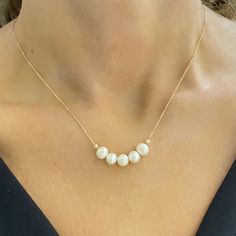 - Beaded Pearl Necklace is made with high quality 14K real solid gold. - Dainty, delicate, elegant and 14K solid gold pearl necklace is a perfect example of a minimalist women's ring. - Beaded necklace is decorated with five Cultured Freshwater Pearls. Pearl size is 6MM and their shape is oval. - You receive beaded pearl jewelry in a beautiful and free gift box - Free shipping (Arrive within 5 business days to the USA and Canada ( 2 day for production + 3 days for shipment)) - 14K Solid Gold Dai Yellow Gold Beaded Pearl Necklace For Wedding, Wedding Yellow Gold Beaded Pearl Necklace, Yellow Gold Beaded Necklaces For Wedding With Polished Beads, Yellow Gold Necklaces With Polished Beads For Weddings, Yellow Gold Wedding Necklaces With Polished Beads, Wedding Yellow Gold Necklaces With Polished Beads, Elegant Tiny Beads Jewelry For Anniversary, Elegant Jewelry With Tiny Beads For Anniversary, Single Strand Akoya Pearl Beaded Necklace As Gift