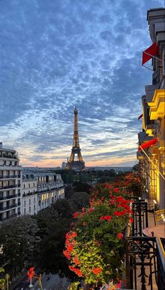 the eiffel tower towering over the city of paris, france at sunset or dawn