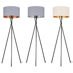 three floor lamps in different colors and sizes