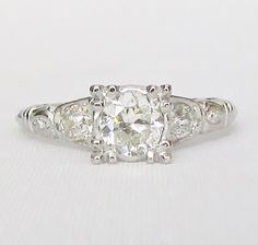 an old cut diamond ring with three stones