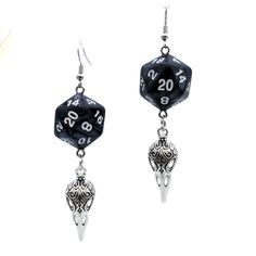 For Raven Queen worshippers who don't want to wear our huge and heavy (but very cool) raven earrings, we also offer this smaller, lighter (but still very cool) version. Each has a pearl black D20. Beneath the dice hang silvery raven skull charms. These would be a perfect accessory for someone playing a member of the shadar-kai or a cleric that worships the Raven Queen. A great gift for players of D&D, Pathfinder, and other tabletop RPGs -- or for anyone who wants to geek out with a fun and myste Black Fantasy Style Earrings, Black Fantasy Earrings, Black Fantasy Style Pierced Earrings, Black Skull Earrings For Gift, Adjustable Black Skull Earrings, Adjustable Black Skull-shaped Earrings, Black Fantasy Dangle Jewelry, Nickel Free Black Skull Earrings, Black Novelty Drop Earrings