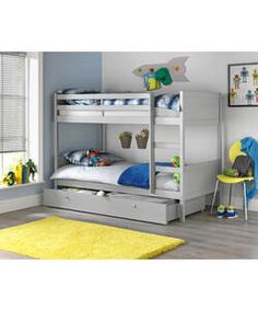 a child's bedroom with two bunk beds and a yellow rug on the floor