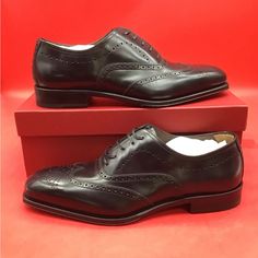 New Elongated And Elegant Proportions Define The Poveda Oxford Shoe From Ferragamo. Crafted From Soft Calf Leather, These Lace-Up Pair Are Finished With Intricate Broguing On The Toe And Upper, Displaying Expert Craftsmanship And An Element Of British Charm. Composition Outer: Calf Leather 100% Lining: Calf Leather 100% Sole: Calf Leather 100% Includes Box And Dust Bags Size 9.5 Ee (Wide) Elegant Goodyear Welted Calf Leather Shoes, Elegant Goodyear Welted Leather Shoes For Galas, Formal Fitted Oxfords With Red Sole, Elegant Oxfords With Rubber Sole For Galas, Elegant Leather Shoes With Brogue Detailing For Galas, Elegant Black Leather Shoes With Brogue Detailing, Elegant Calf Leather Dress Shoes With Rubber Sole, Elegant Wingtip Leather Shoes, Elegant Black Wingtip Leather Shoes