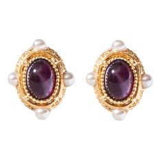 The Evander Earrings from the Lucresia Collection is a must-have for any modern muse. These earrings are made with 24kt gold electroplated brass, purple or green Czech glass stones, and Majorca glass pearls. They are clip-on earrings, making them easy to wear. These 1.33" L x 1" W earrings are perfect for making a statement, always made to order in our New York City design studio. Please allow 7-14 business days for production before the ship date. Elegant Purple Cabochon Earrings, Elegant Purple Clip-on Earrings, Elegant Purple Clip-on Earrings For Formal Occasions, Purple Clip-on Earrings For Formal Occasions, Earrings Making, Modern Muse, Majorca, 24kt Gold, City Design