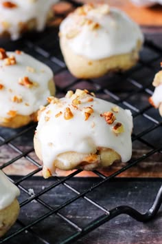 there are some cookies that have been frosted with white icing and chopped nuts