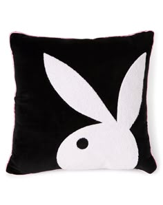 a black and white pillow with a bunny face on it