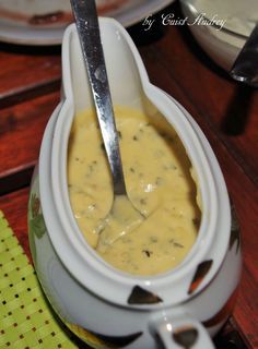 a spoon is in a bowl filled with soup