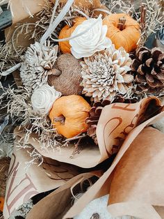 a bunch of paper bags filled with different types of fall decorations