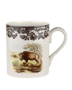 a coffee cup with an image of a bison on the front and side of it