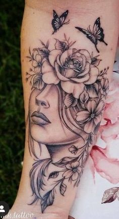 a woman's face with flowers and butterflies on her arm