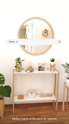 a white shelf with some plants on it and a round mirror above the shelf that says home