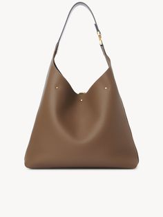 Chloé Marcie Hobo Bag In Grained Leather | Chloé US Brown Pebbled Leather Hobo Bag For Everyday, Brown Pebbled Leather Hobo Bag, Modern Leather Shoulder Bag With Grained Texture, Everyday Pebbled Leather Hobo Bag With Gold-tone Hardware, Modern Pebbled Leather Bag, Modern Everyday Pebbled Leather Hobo Bag, Everyday Luxury Textured Calf Leather Shoulder Bag, Modern Pebbled Leather Bag For Everyday Luxury, Luxury Everyday Calf Leather Hobo Bag