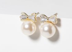 "A striking twist on the classic pearl stud earrings, perfect for a beautiful bride on her wedding day.   They are crafted from Swarovski glass pearls, 925 Sterling silver,  and Cubic Zirconia. As the base metal is 925 sterling silver, you can be sure of no skin irritation or  tarnishing, lovely to wear for future occasions and remind you of your special day.  The diameter of the pearl is 10mm. Available with a 14k gold plating (still sterling silver underneath) Swarovski pearls are vegan friend Elegant Pearl White Bridal Earrings For Gift, Bride On Wedding Day, Earrings For Bride, Cubic Zirconia Earrings, Skin Irritation, Wedding Jewelry Earrings, Zirconia Earrings, Wedding Jewellery, Swarovski Pearls