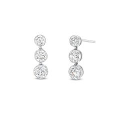 Turn up the sparkle on your style with these lab-created diamond three-stone drop earrings. 14K white gold Each linear drop features a trio of round certified lab-created diamonds graduating in size to the largest 1/4 ct. stone at the base F color/SI2 clarity Includes certification card 1 ct. t.w. of lab-created diamonds Friction backs Three Stone Diamond Earrings In Fine Jewelry Style, Fine Jewelry Three Stone Diamond Earrings, Fine Jewelry Three Stone Diamond White Earrings, Elegant Diamond White Three Stone Diamond Earrings, Three-stone Diamond Earrings For Anniversary, Three Stone Earrings In Fine Jewelry Style, Elegant Three Stone White Gold Earrings, Formal Diamond Three Stone Earrings, Three Stone Fine Jewelry Earrings