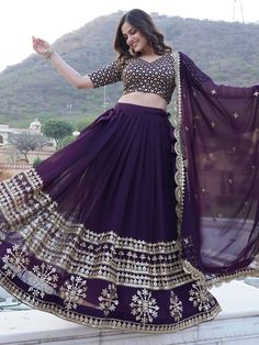 Indulge in the allure of royalty with this enchanting purple georgette lehenga, adorned with intricate embroidery and lavish sequin work. Paired with a matching georgette choli featuring opulent sequins and multi-embroidered motifs, and complemented by a georgette dupatta showcasing exquisite embroidery, sequin accents, and a delicate lace border, this ensemble exudes sophistication and charm.
The lehenga is stitched up to 42 inches with can-can for added volume, boasting a generous 3.5-meter fl Purple Georgette Choli With Traditional Drape, Festival Embellished Georgette Choli, Embellished Georgette Choli For Navratri, Festive Embellished Georgette Choli, Elegant Purple Lehenga For Navratri, Purple Georgette Saree Set, Purple Chinon Sharara With Mirror Work, Purple Floor-length Sharara For Navratri, Purple Georgette Sets With Zari Work