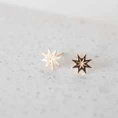 Meet Supernova, your newest little piece of luxury crafted in solid 14k gold. They have a stunning, rich gold color that catches the light in the most mesmerizing way. They have this gorgeous starburst shape that adds a touch of celestial magic to any outfit. The best part is their versatility. You can dress them up for a fancy night out or wear them with a casual jeans and t-shirt combo. They instantly elevate any look and add a touch of elegance and sophistication. It's like having a secret we Celestial 14k Yellow Gold Earrings, 14k Gold Celestial Yellow Gold Earrings, 14k Yellow Gold Celestial Earrings, 14k Gold Star Shaped Pierced Jewelry, Yellow Gold Star Earrings, Minimalist 14k Gold Star Charm Earrings, Minimalist 14k Gold Earrings With Star Charm, Elegant Starburst Jewelry As Gift, Elegant Starburst Jewelry Gift