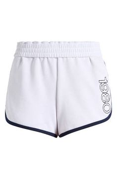 Work out or chill out in these sporty French terry shorts designed with an elastic waistband and contrasting trim. Elastic waist 60% cotton, 40% polyester Machine wash, line dry Imported Athleisure Bottoms With Contrast Trim For Loungewear, White Activewear With Contrast Trim For Sports, Casual Short Bottoms With Contrast Trim, Sporty Loungewear Bottoms With Logo Waistband, Sporty White Activewear With Contrast Trim, White Jogging Bottoms With Elastic Side Panels, White Bottoms With Elastic Side Panels For Jogging, Athleisure Bottoms With Logo Waistband For Jogging, White Athletic Shorts For Summer Jogging