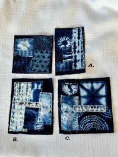 four square pieces of blue and white fabric