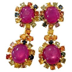 Bochic "Orient” Ruby & Multi Sapphire Earrings Set In 18K Gold & Silver Natural Ruby Oval Shapes - 17 Carats Multi Color Sapphires from Sri Lanka - 4.50 Carat Colors : Pink, Blue, Green, Yellow, Orange The earrings from the "Orient" traveling collection are the epitome of elegance and versatility. They offer a perfect blend of day to night and swimwear to evening wear, allowing you to effortlessly transition between different occasions and outfits. Wearing these spectacular drop oriental-style earrings will undoubtedly make you the center of attention. They add a touch of glamour and sophistication to your favorite caftans, swimwear, or evening attire, enhancing your overall look. The "Orient" collection, from which these earrings originate, showcases exceptional craftsmanship and incorpor Multi Sapphire, Sapphire Earrings, Natural Ruby, Style Earrings, Evening Attire, Natural Pearls, Yellow Orange, Earrings Set, Evening Wear