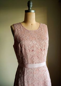 A soft muted blush pink shade dress in beautiful guipure lace Fully lined Zipper back Grosgrain ribbon at the waist Lined Tulle insets at the hem of skirt Reminiscent of a 50s dress Label: BCBG Women's US size 10 Measurements: 19 inches armpit to armpit laying flat 15 1/2 inches across at the waist laying flat 40 inches from back of collar to hem of dress Excellent condition Sleeveless Bridesmaid Lace Dress With Lace Back, Sleeveless Lace Back Dress For Bridesmaids, Sleeveless Lace Dress With Lace Back For Wedding, Fitted Pink Bridesmaid Dress With Lace Bodice, Sleeveless Lace Dress For Bridesmaid, Sleeveless Lace Back Dress For Wedding Guest, Feminine Sleeveless Bridesmaid Dress For Wedding, Blush Sleeveless Wedding Dress, Sleeveless Pink Lace Wedding Dress