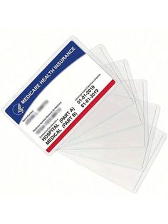 five clear plastic identification cards with red and white stripeing on the front, one for medical health assurance