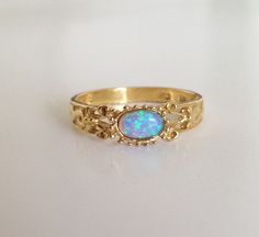 20% off SALE Blue Opal Ring Oval Opal Gold by HolyLandJewelry Adjustable Gold Opal Ring Fine Jewelry, Gold Opal Birthstone Ring For Anniversary, Heirloom Gold Opal Gemstone Ring, Heirloom Gold Opal Promise Ring, Fine Jewelry Gold Opal Birthstone Ring, Adjustable 14k Gold Opal Ring Gift, Gold 14k Opal Ring As Gift, 14k Gold Opal Ring For Gift, Gold Opal Gemstone Ring Gift