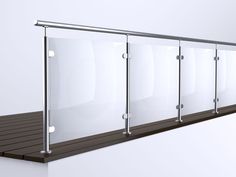 a row of glass partitions on top of a wooden floor next to a white wall