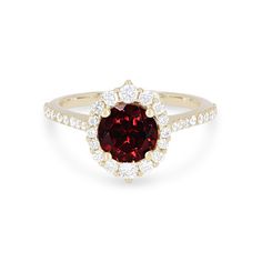 a red and white diamond ring with an oval shape center surrounded by small round diamonds