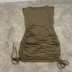 Olive Casual Shoulder Pad T-Shirt Adjustable Mini Dress. Adjustable Ties To Cinch For A Mini Dress All The Way Down To A Midi Dress. Second Picture Is Just To See The Fit. Actual Color Is Olive Green. Never Worn. No Tags. Casual Tops For Day Out By Amazon, Casual Amazon Tops For Day Out, Amazon Sleeveless Summer Tops, Casual Sleeveless Mini Dress By Amazon, Amazon Sleeveless Casual Dress, Amazon Casual Sleeveless Dress, Amazon Stretch Tops For Summer, Casual Stretch Mini Dress With Drawstring, Summer Mini Dress With Drawstring And Short Sleeves