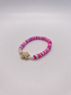 Handmade 7 in. preppy beaded bracelet. Contains light pink, hot pink, white, and purple 6mm clay beads. Also has pearl beads, and a cute turtle bead!! I can custom create any jewelry for you. Just let me know what colors you want, and if you want a word on it or not. I can also make phone charms and rings, and necklaces. Pink Heishi Beads Friendship Bracelets For Vacation, Pink Friendship Bracelets With 8mm Round Beads, Pink Round Beads Friendship Bracelets For Vacation, Pink Heishi Beads Bracelets For Vacation, Hypoallergenic Pink Friendship Bracelets For Beach, Pink Stretch Bracelet With Letter Beads For Vacation, Hypoallergenic Pink Beaded Bracelets For Beach, Playful Pink Jewelry For Vacation, Pink Pearl Bracelet With Multicolored Beads For The Beach