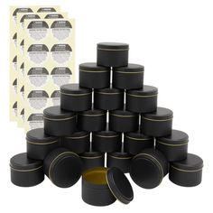 a stack of black and gold containers next to a piece of paper with an advertise