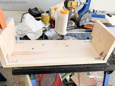 a workbench with various tools and materials on it