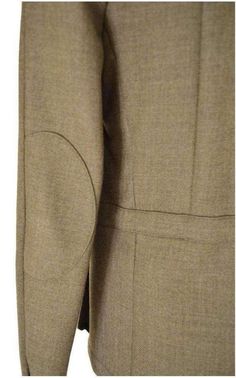 This khaki-green gabardine jacket is a streamlined take on a utility style with padded shoulders – a signature of the house – hidden front button closure, and flap-front pockets.Main - 100% Wool Lining - 100% Cotton Made in FranceSize FR48 - S Shoulder to shoulder 17" Pit to pit 19.5" Waist 36" Length 27.5" Size FR50 - M Shoulder to shoulder 18" Pit to pit 20.5" Waist 37" Length 27.5" Classic Khaki Blazer For Fall, Fitted Single-breasted Khaki Utility Jacket, Classic Fitted Brown Utility Jacket, Fitted Classic Brown Utility Jacket, Winter Tailored Khaki Blazer, Fitted Single Breasted Khaki Outerwear, Tailored Khaki Winter Blazer, Tailored Khaki Blazer For Winter, Classic Khaki Blazer For Office