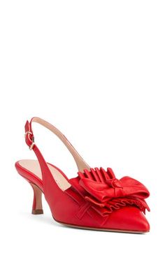 A whimsical bow and voluminous ruffles make an eye-catching statement at the vamp of a stunning leather pump framed by a pointy toe and tapered heel. 3" heel Adjustable slingback strap with buckle closure Memory foam cushioning Leather upper, lining and sole Made in Italy Party Heels With Ruffles And Round Toe, Chic Heels With Red Bow, Chic Formal Heels With Red Bow, Evening Heels With Red Bow And Pointed Toe, Red Pointed Toe Heels With Bow, Elegant Slingback Pumps With Red Sole For Party, Ruffled High Heel Evening Shoes, Ruffled Pointed Toe Party Heels, Chic Red Heels With Bow