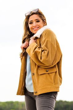 Complete any look with this stylish and comfortable jacket! -Color: Camel -Removable faux fur collared -Button down/ Zip up -Side flap pockets -Oversized silhouette -Content: 100% Cotton -Imported -Model is 5'5" 36-30-40 and wearing a size Small Corduroy Sherpa Jacket, Sherpa Jacket, Oversized Silhouette, Faux Fur Collar, Fur Collars, Modern Fashion, Flap Pocket, Clothing Brand, Camel